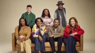 The cast of Abbott Elementary sitting on a couch for Season 5 on ABC