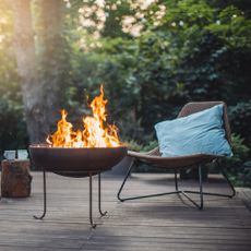 Fire pit and chair on deck