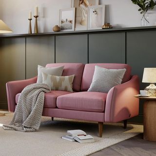Pink sofa in a neutral living room