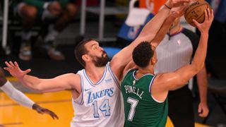 Marc Gasol #14 of the Los Angeles Lakers guards Dwight Powell #7 of the Dallas Mavericks at Staples Center on Dec. 25, 2020 in Los Angeles, California.