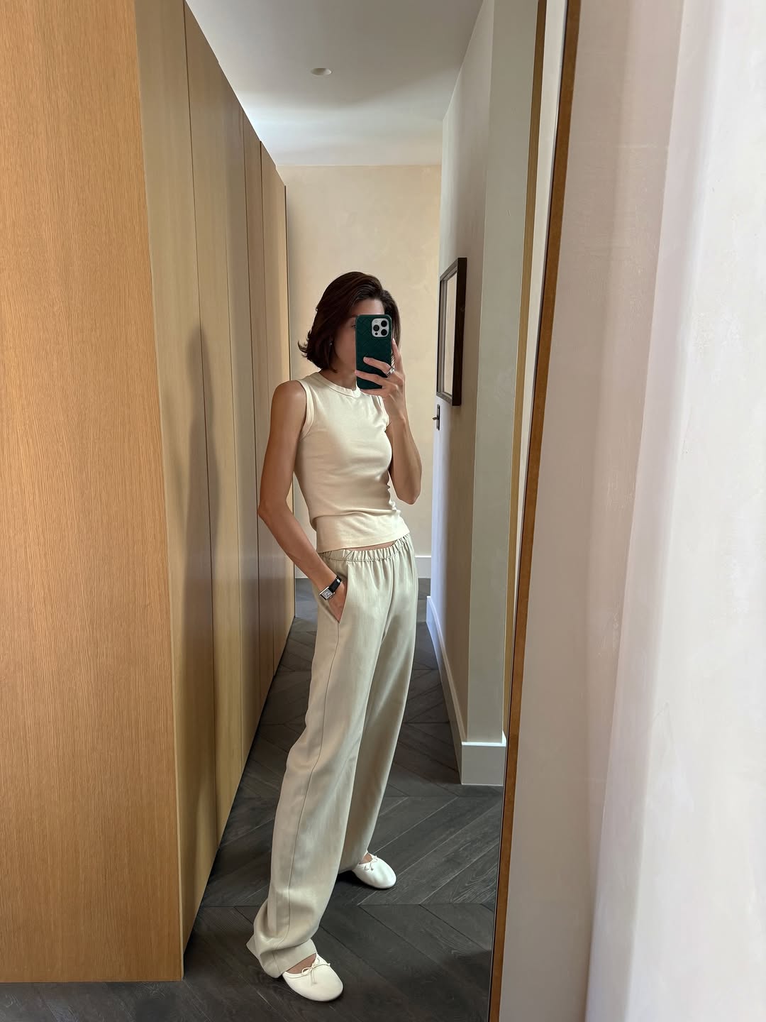 An image of a woman wearing white flats, shoe trend for spring 2026.