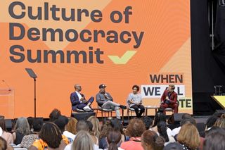 Experts speak on stage at the first ever Culture of Democracy Summit