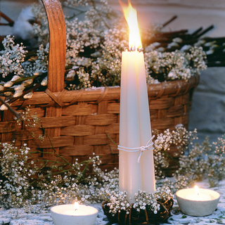 candles with basket and gypsophila