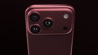 The back of a burgundy iPhone 18 Pro on a black background.