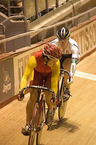 Anna Meares (Australia) keeps a close watch on China's Shuang Guo during the gold medal ride for the women
