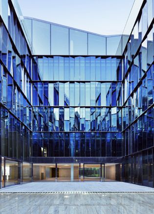 ﻿&#039;Four Courts&#039; is a state-of-the-art business centre, designed by Milan-based architects Piuarch, featuring a panoramic restaurant. The blue courtyard (above) contains a shallow pool