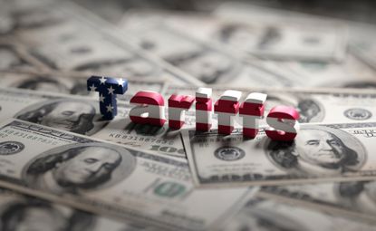 tariffs block letters us flag hundred dollar bills