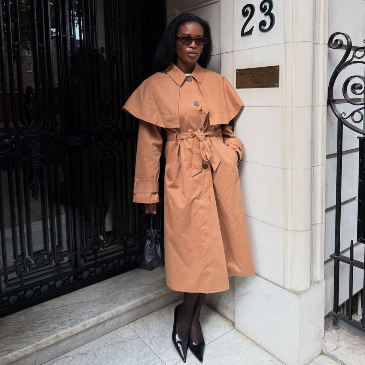 Marilyn Nk wearing the tan Nobody&#039;s Child trench coat