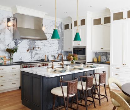 a kitchen with a bookmarked marble splashback