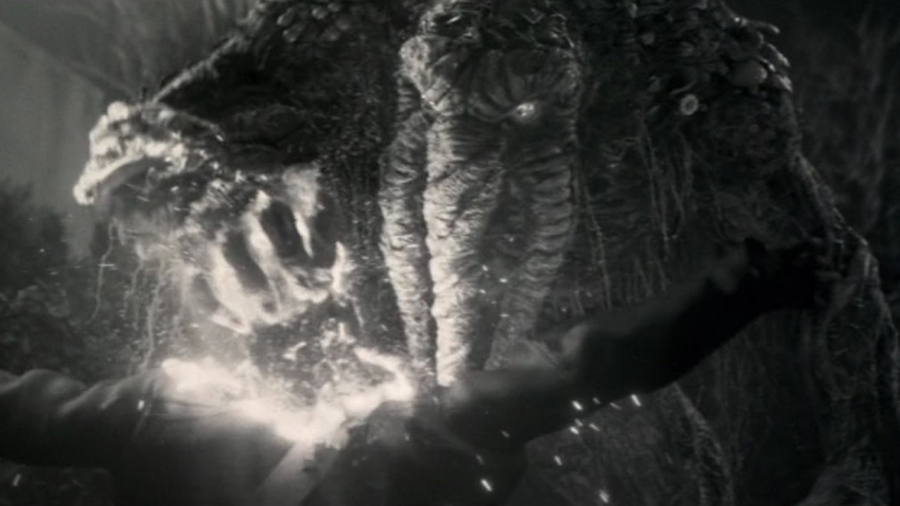 Man-Thing crushes Jovan's skull with his powerful grip and corrosive acid in Werewolf by Night