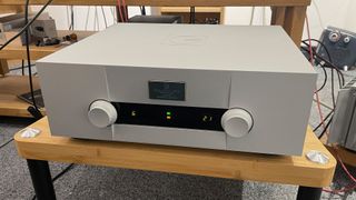 Goldmund Telos 690 integrated amplifier on wooden hi-fi rack