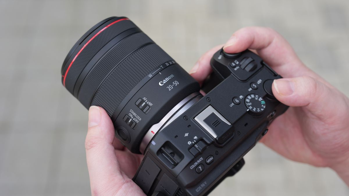 Canon EOS R6 V with the Canon RF 20-50mm f/4L IS USM PZ being held outdoors