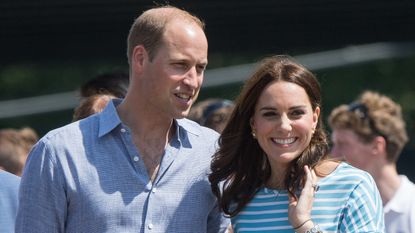 Prince William, Duke of Cambridge and Catherine, Duchess of Cambridge walk together after participating in a rowing race