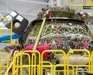 Boeing's CST-100 Starliner, the first to carry a human crew, is seen under construction inside the Boeing Starliner Facility at NASA's Kennedy Space Center in Cape Canaveral, Florida. The spacecraft is scheduled to launch NASA astronauts Eric Boe, Nicole Aunapu Mann and Boeing astronaut Chris Ferguson in 2019.