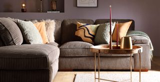 brown cord sofa in brown living room to show key sofa trend 2023