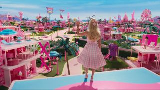 Margot Robbie's Barbie waving to Barbie World