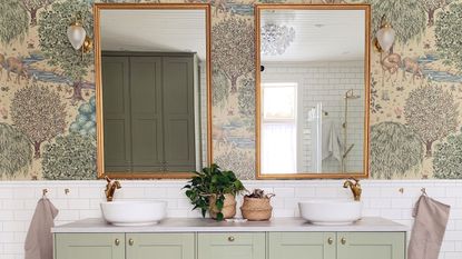 Green IKEA bathroom cabinet with gold mirror