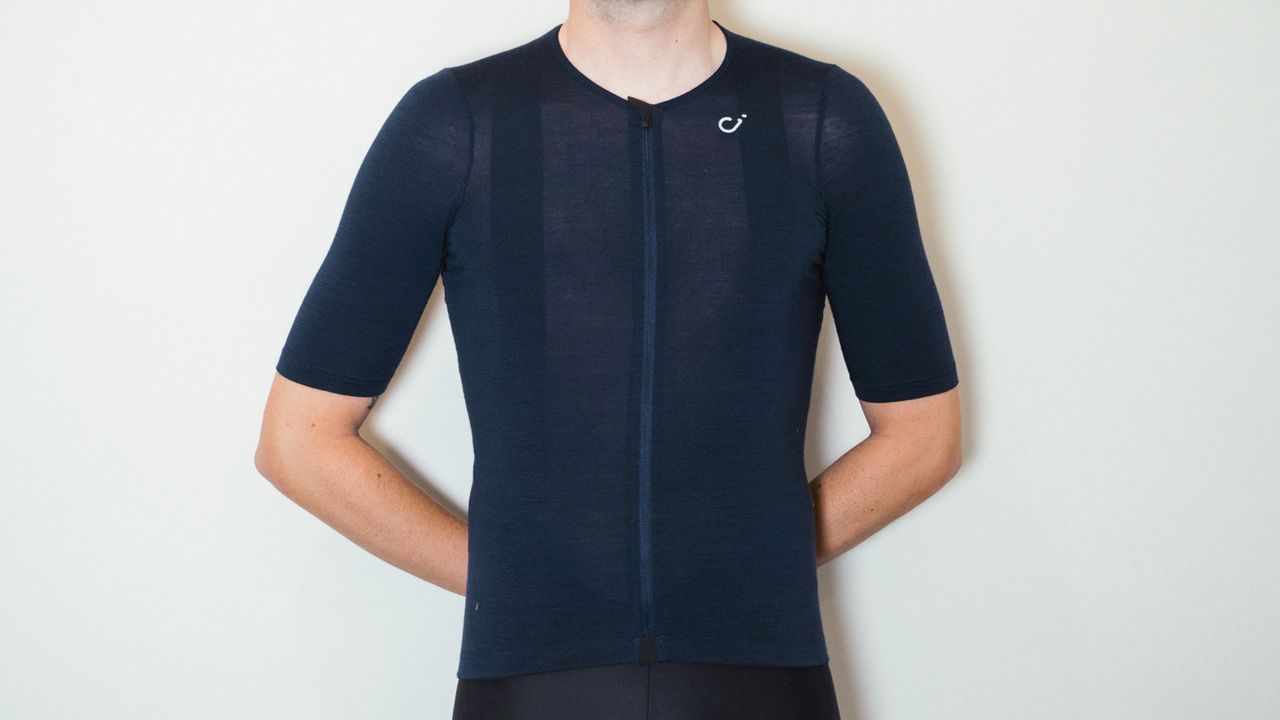 Velocio Concept Merino Jersey being worn by a white male against a white wall