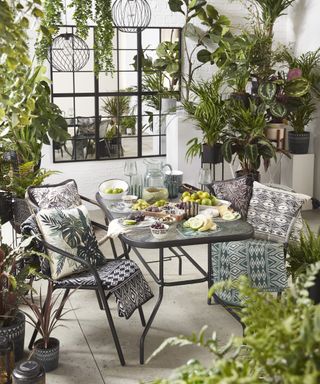 A small outdoor patio area with a mirror pane