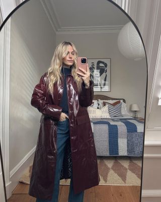 Influencer wears a burgundy leather jacket