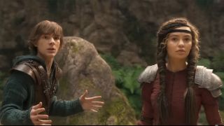 Nico Parker and Mason Thames wear armor while confronting Toothless in How To Train Your Dragon Live Action.