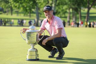 Justin Thomas poses with the Wanamaker Trophy