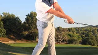 PGA pro John Jacobs demonstrating how to clear your hips in the golf swing properly