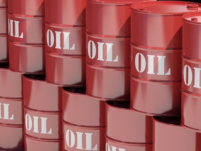 Stacks of red oil barrels with the word OIL written in white