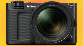 Front view of Nikon ZR and Z 24-70mm f/4 S lens on a yellow-red background