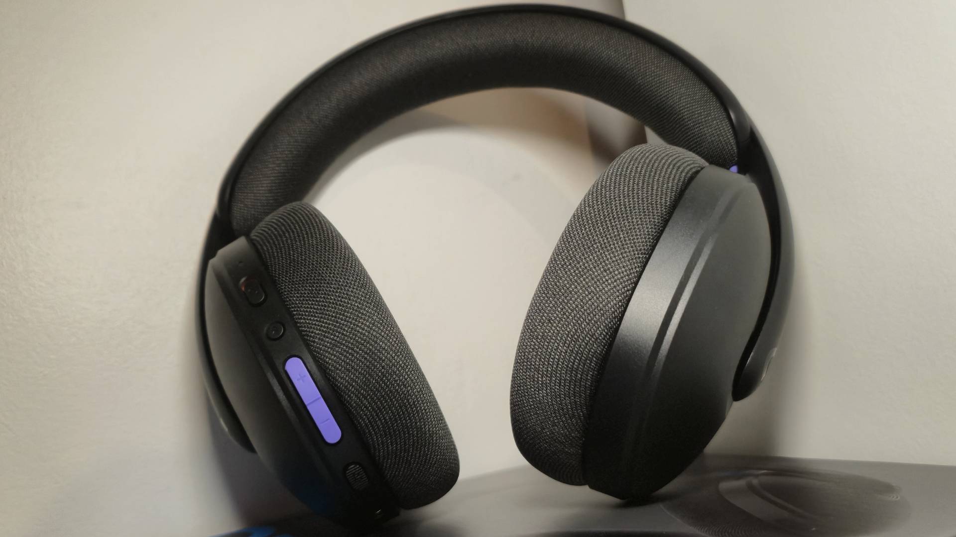 Photo of the Logitech G325 Lightspeed wireless headset sitting on its box in front of a white wall.
