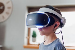 A child wearing virtual reality goggles