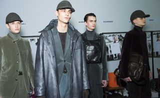 Four models in blue, grey, green and black jackets