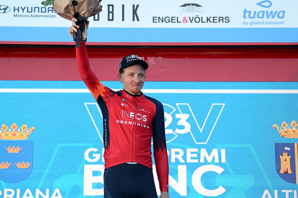 ALTURA SPAIN FEBRUARY 04 Tao Geoghegan Hart of The United Kingdom and Team INEOS Grenadiers celebrates at podium as stage winner during the 74th Volta a la Comunitat Valenciana 2023 Stage 4 a 1816km stage from Burriana to Alto de la Cueva Santa Altura 832m VCV2023 VoltaValenciana on February 04 2023 in Altura Spain Photo by Dario BelingheriGetty Images