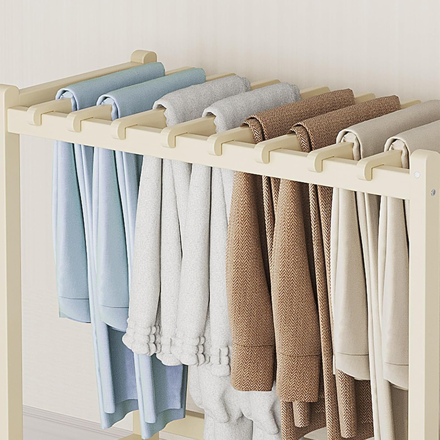 A white pants rack on wheels