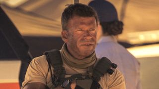 Taylor Sheridan's dirt-faced Cody sitting with Joe in Lioness Season 1
