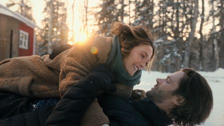 Leighton Meester laying on top of Jared Padalecki outside in Guarding Stars