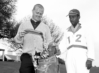 Jack Nicklaus and his caddie at the 1961 Masters