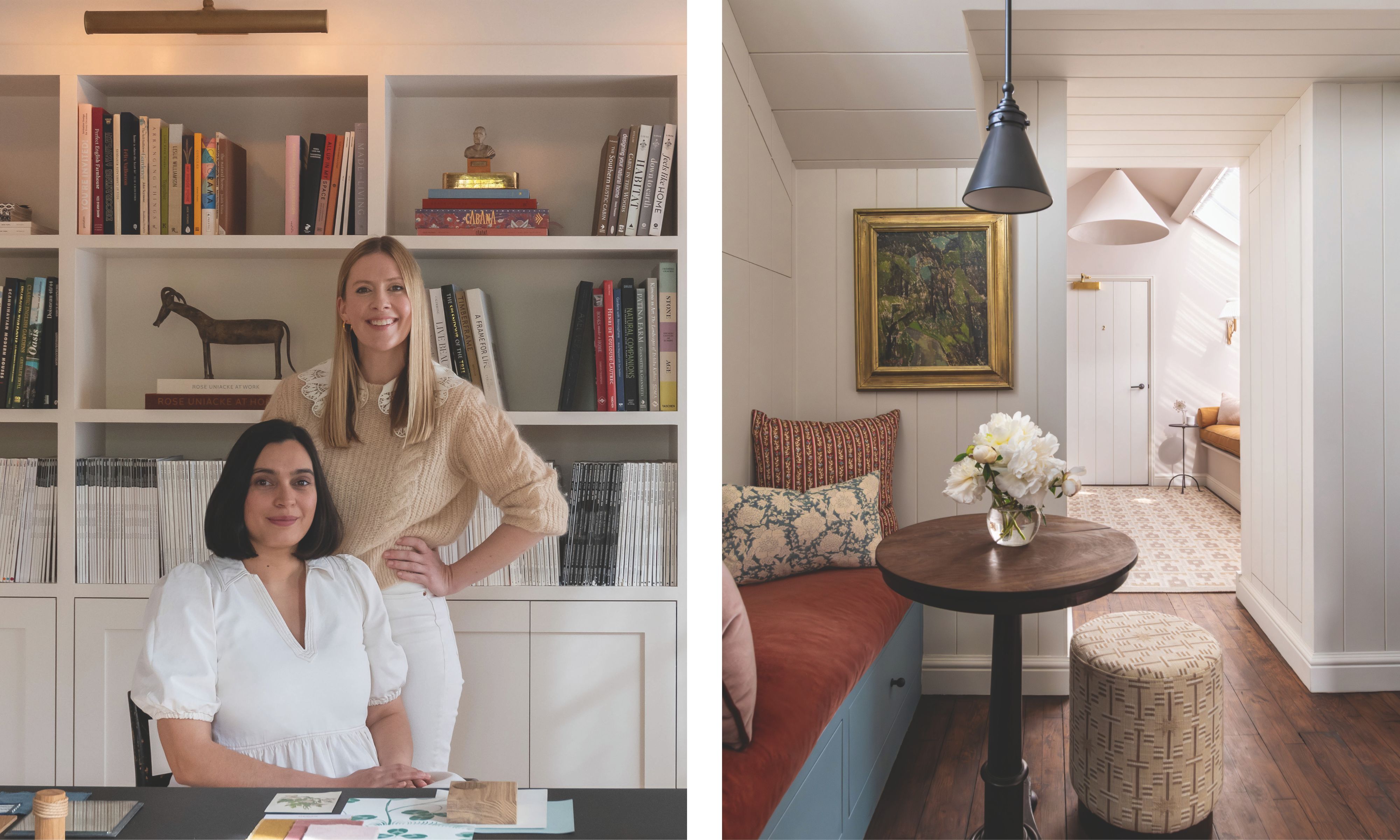 A photograph of designers Hianta Cassam Chenai, sitting in a white blouse, and Laura Graham, standing in a beige sweater, posing in front of a white built-in bookshelf.