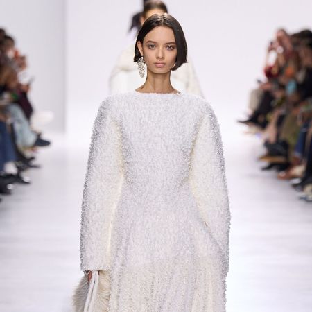 Model wears a textured dress on the Bottega Veneta runway.