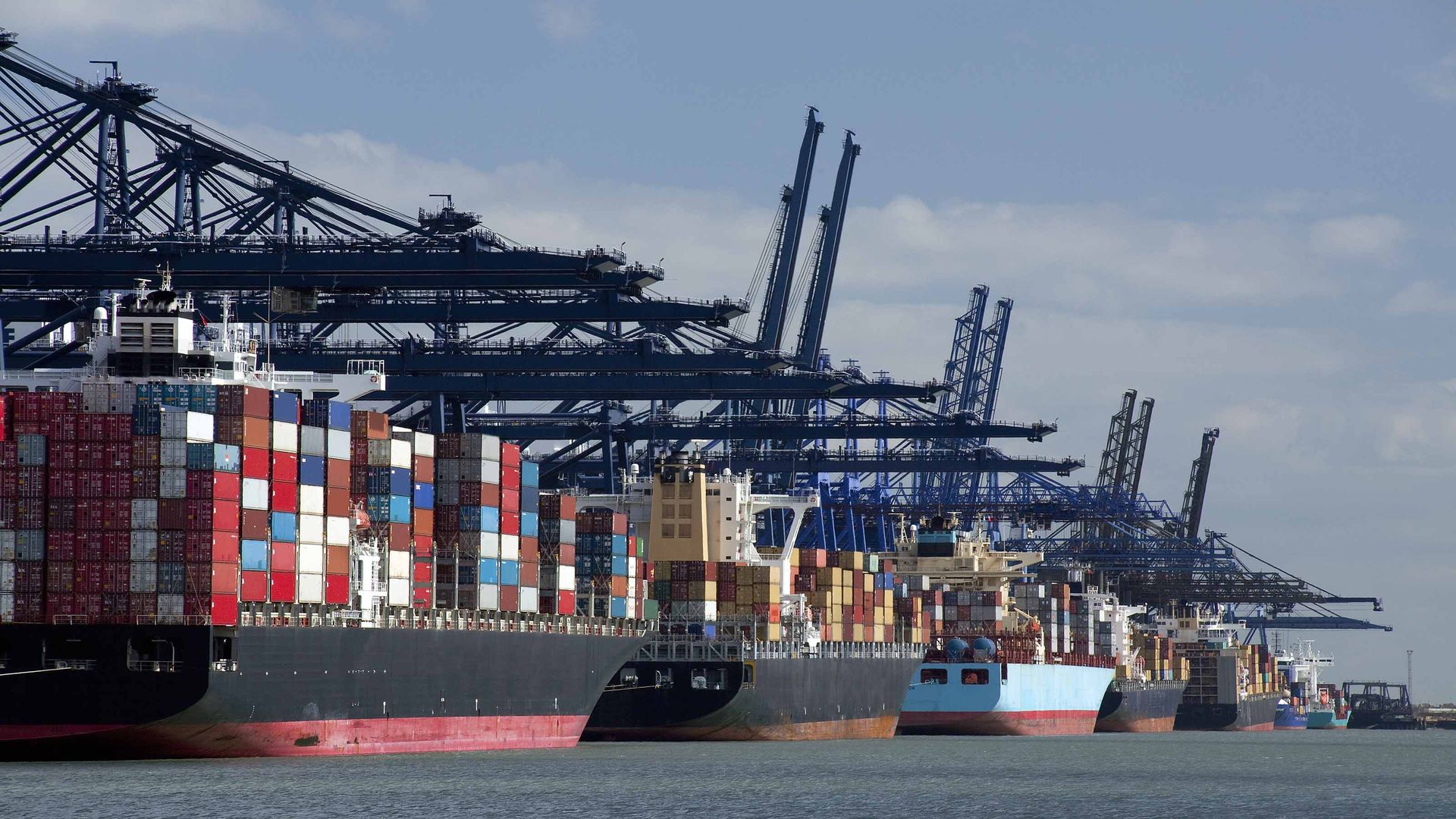 docked cargo ships full of containers