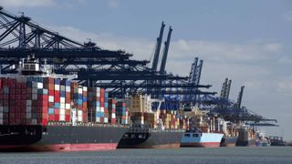 docked cargo ships full of containers