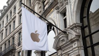 The Apple logo on a white flag at the brand's Regent Street store, representing Apple in the UK.