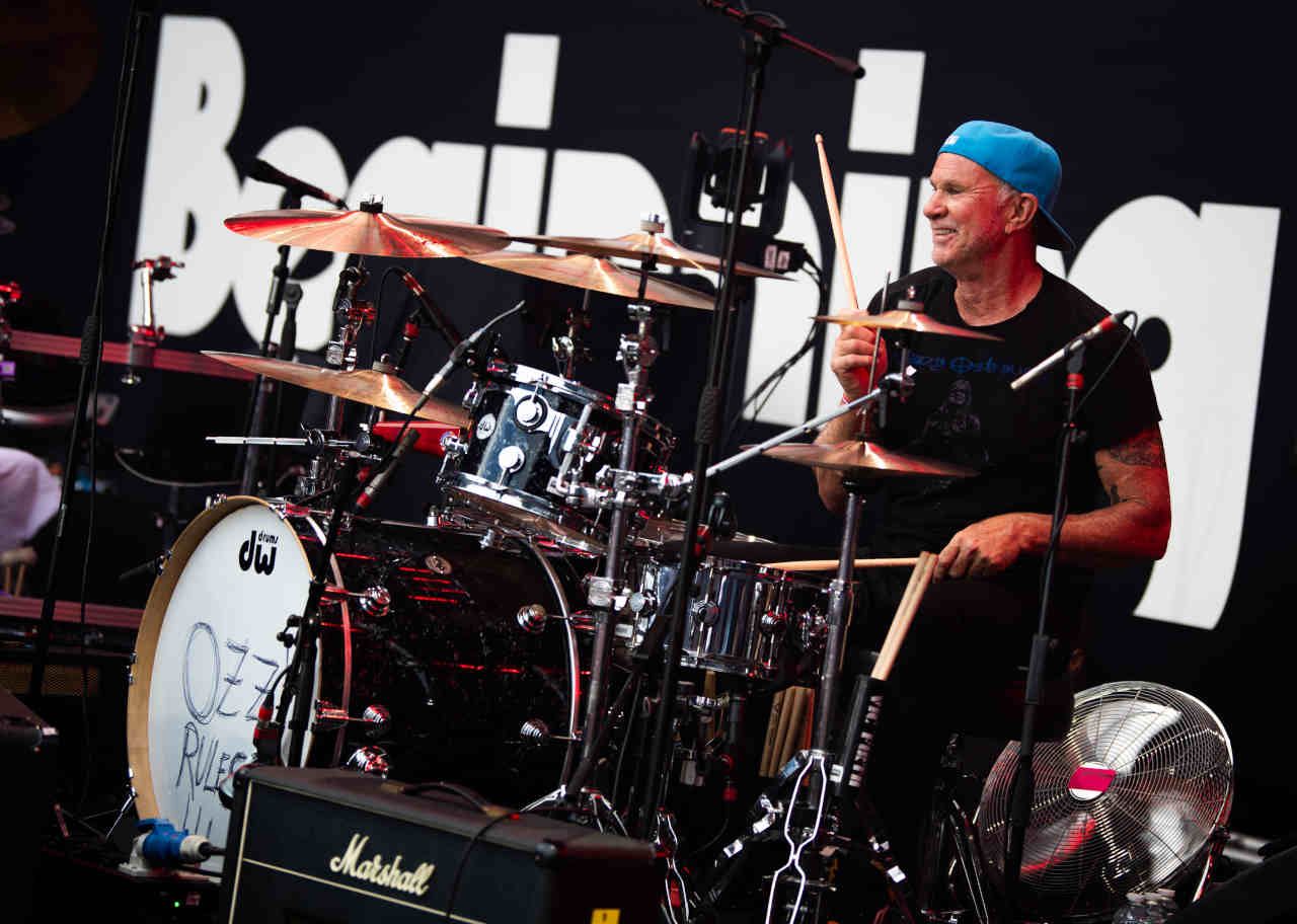 Red Hot Chili Peppers drummer Chad Smith performing onstage at the Back To The Beginning show at Villa Park in July 2025