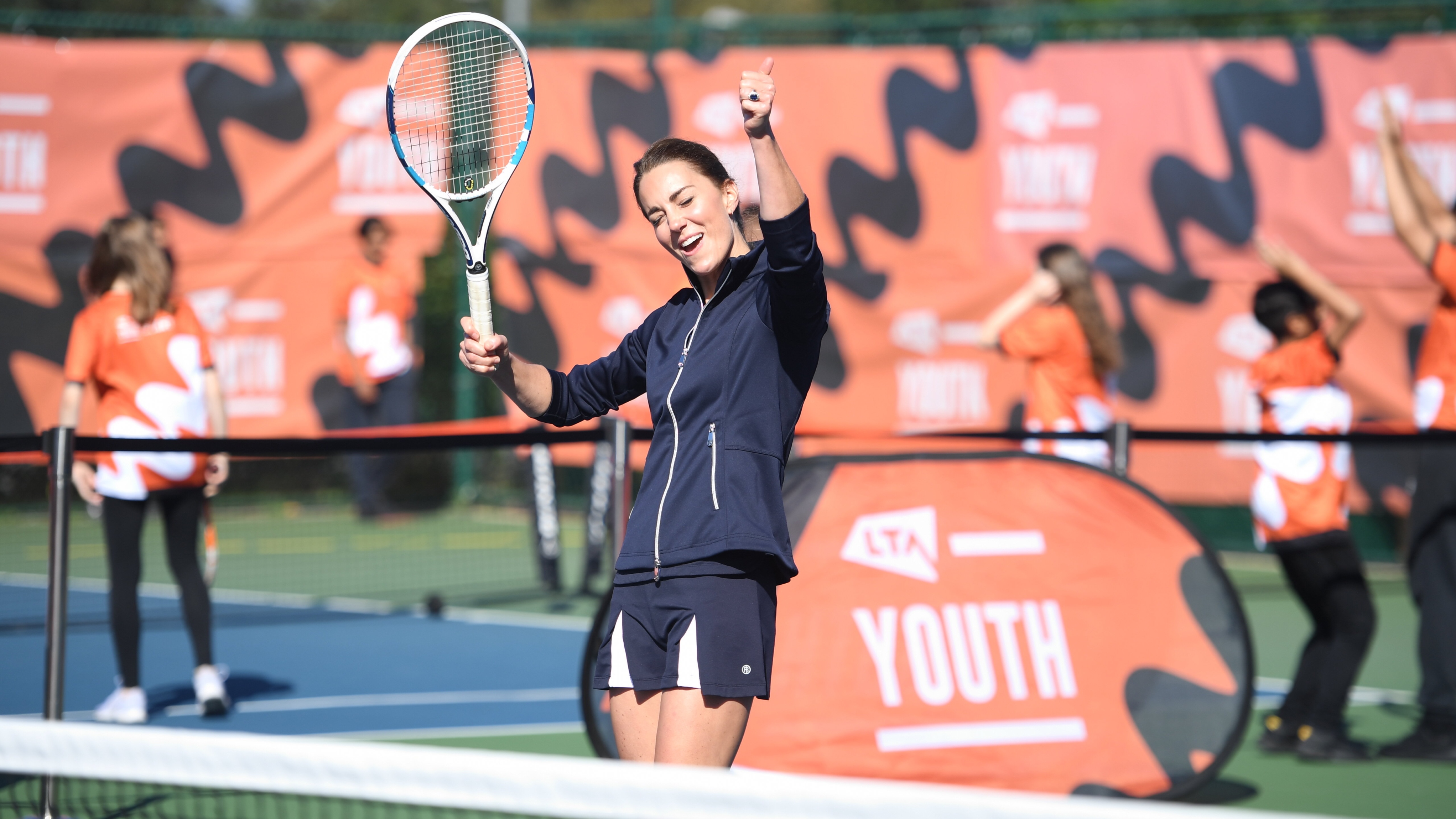Catherine, Princess of Wales celebrates during a game of tennis with US Open Champion Emma Raducanu at the LTA Centre in Roehampton on September 24, 2021