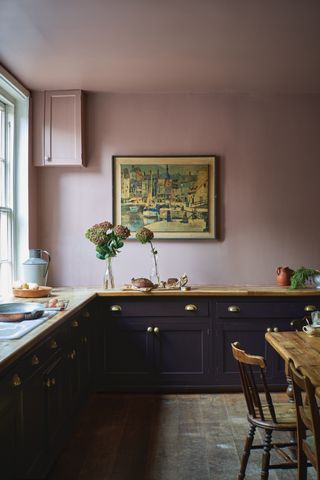 A kitchen painted in Sulking Room Pink by Farrow & Ball