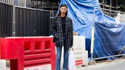 Model in blazer and jeans