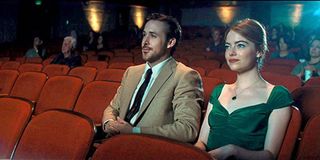 Ryan Gosling and Emma Stone in a movie theater in La La Land