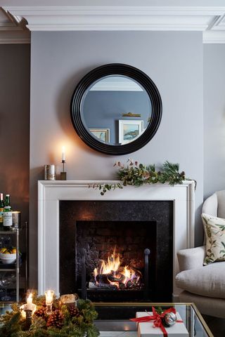 Christmas living room decor and mantelpiece by Sims Hilditch