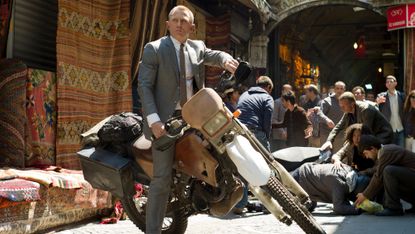 Daniel Craig rides a motorbike as James Bond in Skyfall