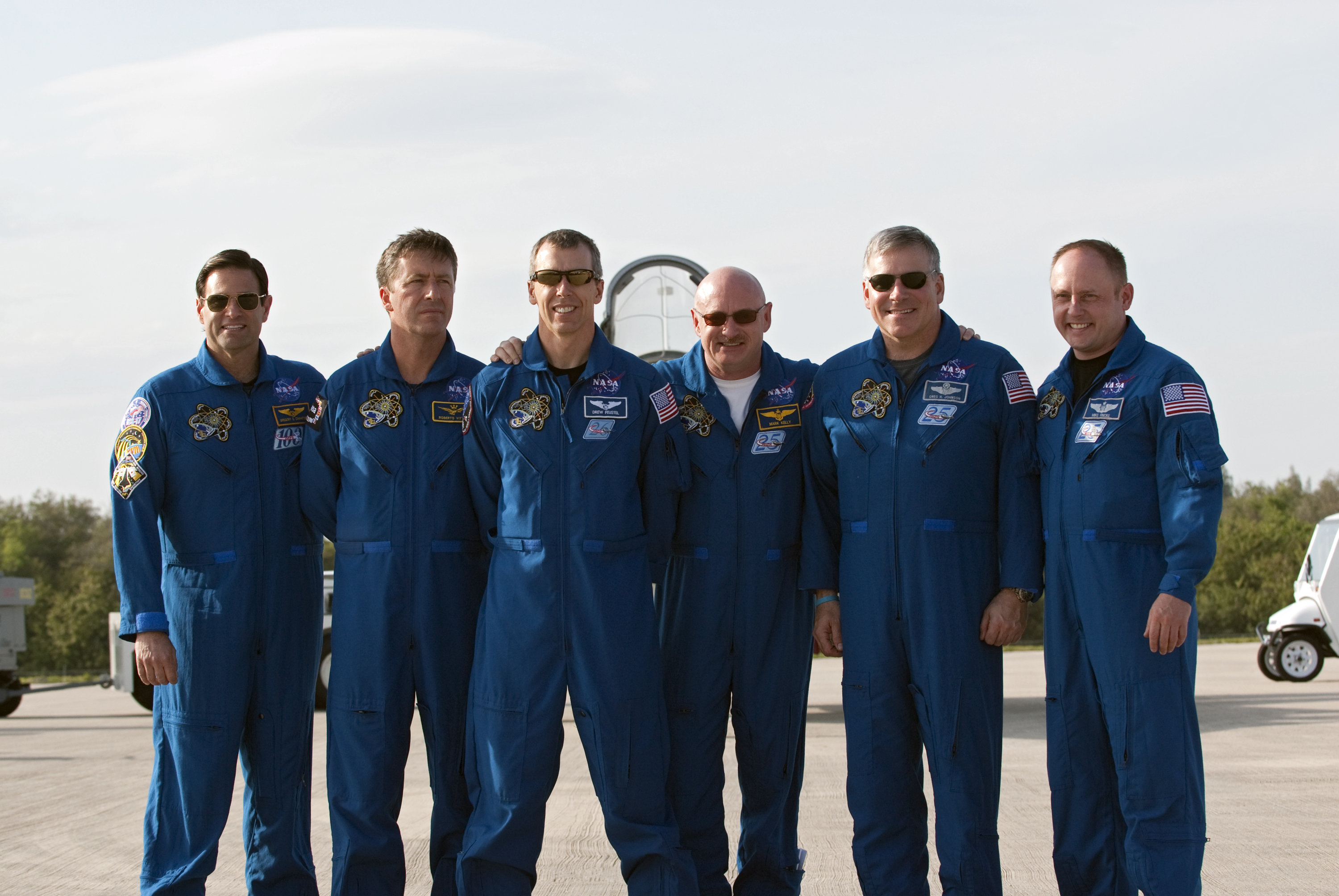 Space shuttle Endeavour&#039;s STS-134 crew members pose for a group photo on the Shuttle Landing Facility at NASA&#039;s Kennedy Space Center in Florida after arriving on March 29, 2011 to begin final launch training ahead of an April 19 liftoff.